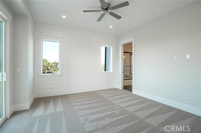 Bedroom 2 with private bathroom on the right from hallway.