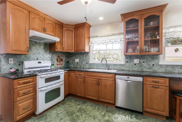 Nwere kitchen with granite counters and beautiful cabinets