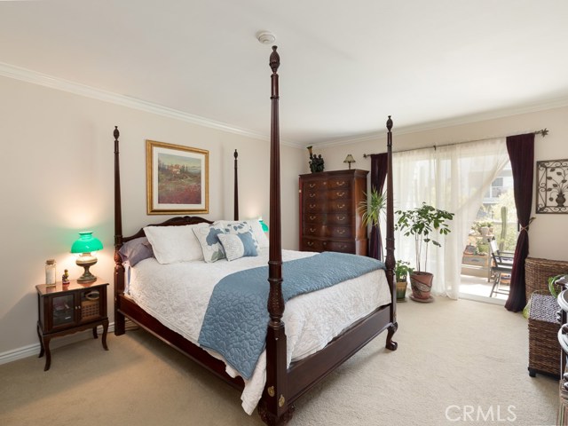 Master bedroom is very large and easily accommodates a king-size bed and multiple dressers.  Sliding door leads to patio ideal for sitting for morning coffee or evening glass of wine.