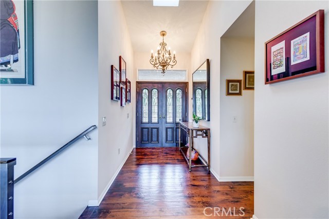 the foyer is beaming with natural light when you enter from the high ceiling and skylight