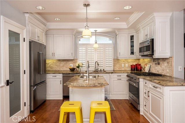 Granite countertops, stainless steel Viking appliances, pantry, island with prep sink...this kitchen has it all!