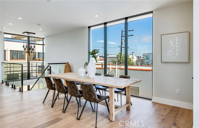 Dinner with a view? The dining room is surrounded by floor to ceiling windows that offer gorgeous views