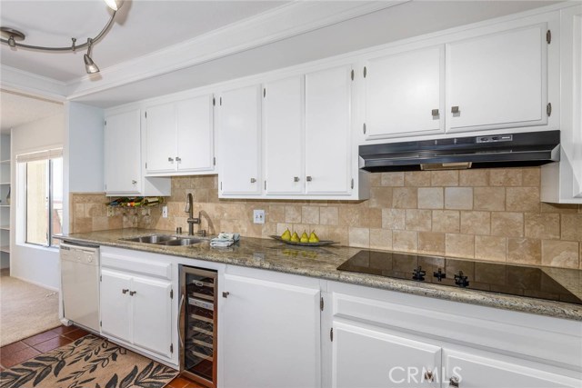 Updated kitchen with beverage cooler.