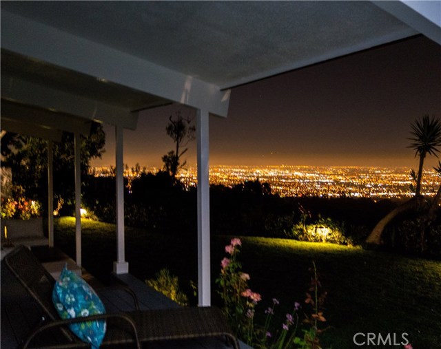 Mesmerizing city lights view at night from the back deck, family room, living room, den and master suite!