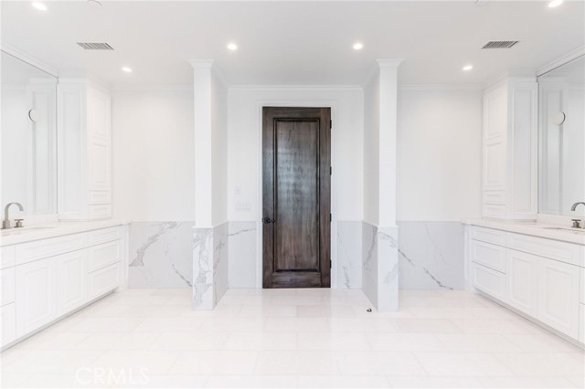 Duel sink and vanity areas on either side of the master suite bathroom