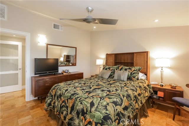 Large master bedroom with walk in closet, plantation shutters, dual paned windows.