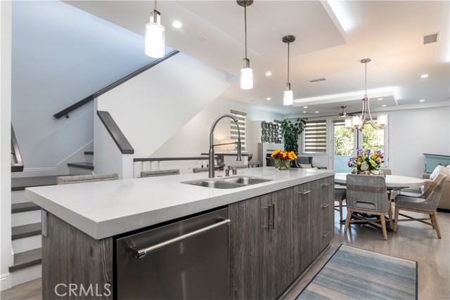 Kitchen with stairs leading to the upstairs 4th bedroom or loft