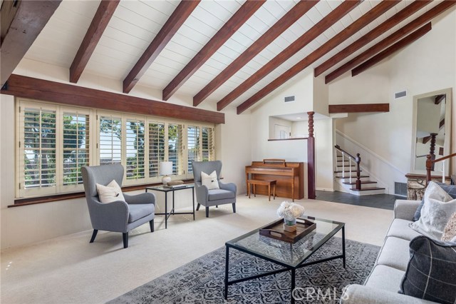 The ocean view living room brings gorgeous golden sunsets in a picturesque setting. The quintessential charm of a Palos Verdes Estates Ranch home can be found in the detail of this custom built home.