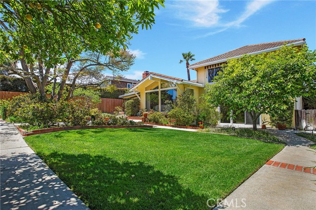 Picture windows throughout with almost all rooms opening to the tranquil yard