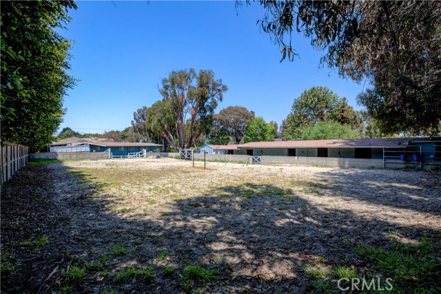 Looking from the Ernie Howlett Trail toward the back of the house, barn and jumping arena.