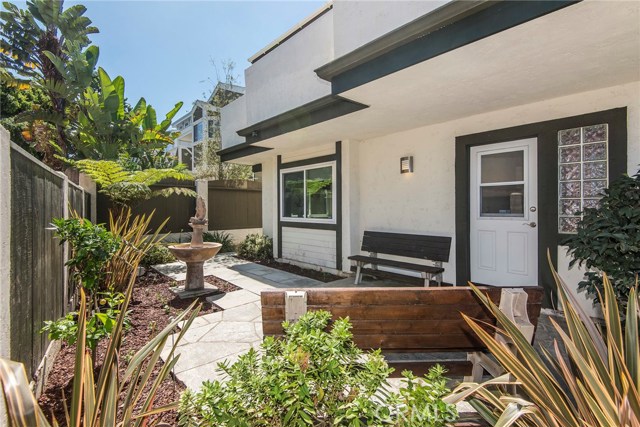 Beautiful backyard/Lanai off downstairs perfect for BBQs, Entertaining, Sunday Breakfast or Put out a firepit and enjoy long summer evenings here!