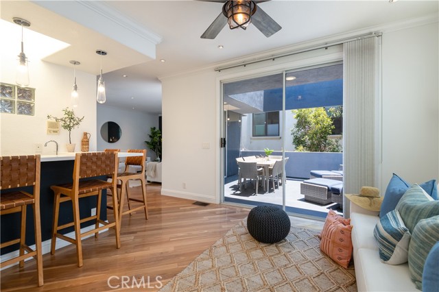 Den off the kitchen with a wet bar and access to the deck.