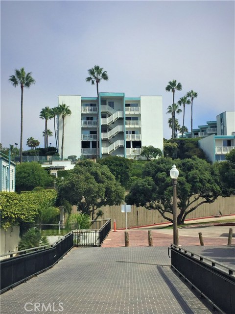 Looking back towards the Building, Unit #116 is the Ground Floor End Unit next to the Exterior Stairway.