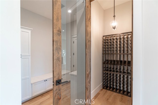 View of inside of wine cellar  and mud room on the left hand side (that leads out to the garage).