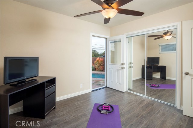 Bedroom #3 with easy access to the backyard, lounge area, and pool.