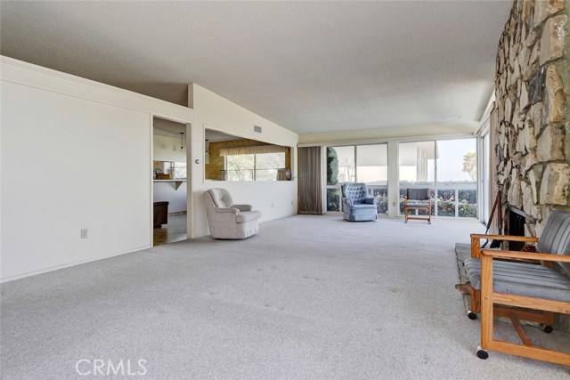 LARGE LIVING ROOM LOOKING EAST  TO THE DINING/FAMILY ROOM.