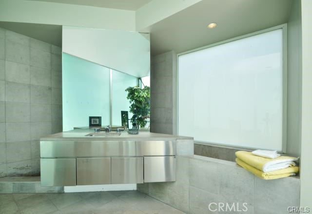 The master bathroom retreat area... I could live in this room ... It has the best view in the home... where I took the picture from is an all glass floor to ceiling wall! Walk in shower and soaking tub...note in the mirror you can see the shoji screens and a bit of the glass wall!