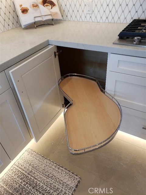 custom corner cabinet, floor lighting