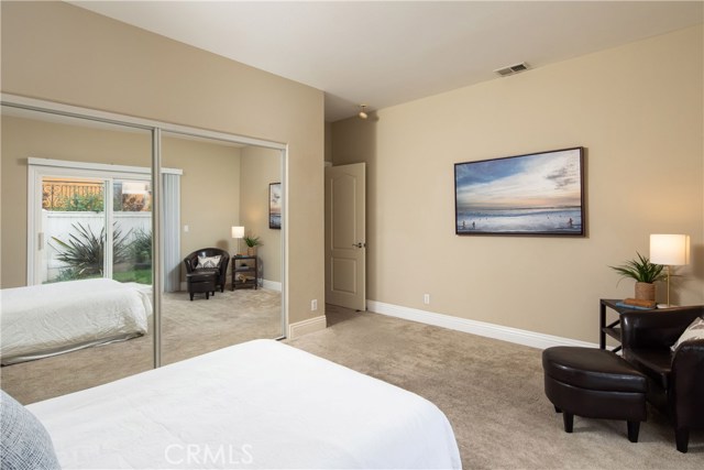 Bedroom #2 - A spacious retreat with large closets and direct access to the private backyard.