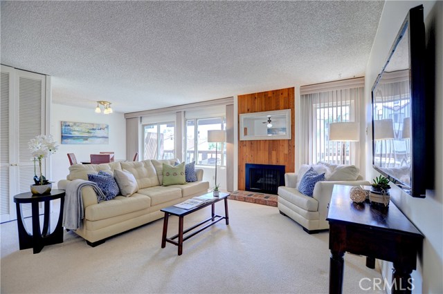 Living room with gas fireplace and balcony with large deck Living room with gas fireplace and balcony with large deck