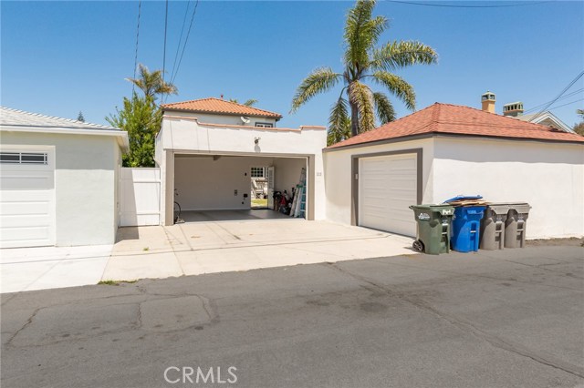 two car garage is open and the third (with storage room) on the right two car garage is open and the third (with storage room) on the right