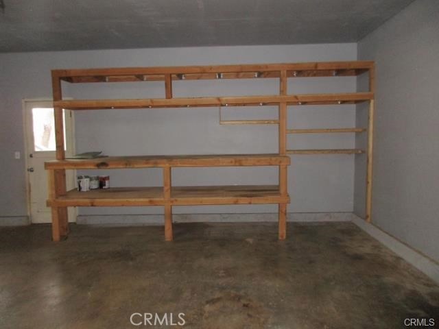 Over Sized Attached Garage with loads of storage shelves