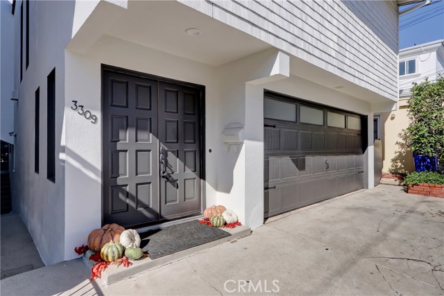 Charming entry plus plenty of parking with a 2 car garage and parking on the drive area.