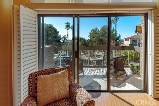 A large VIEW balcony is accessed directly from the Living area.