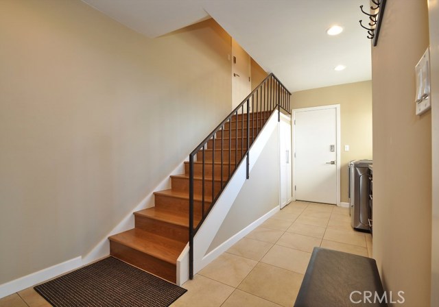 Stairway to and from garage. Don't miss large luggage storage at top of stairway.