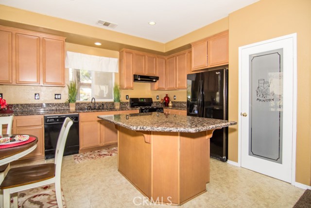 Kitchen Island with Granite Counters and New Pantry Door