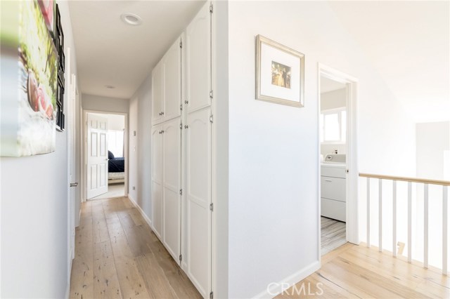 top floor hallway leading to bedrooms and laundry room