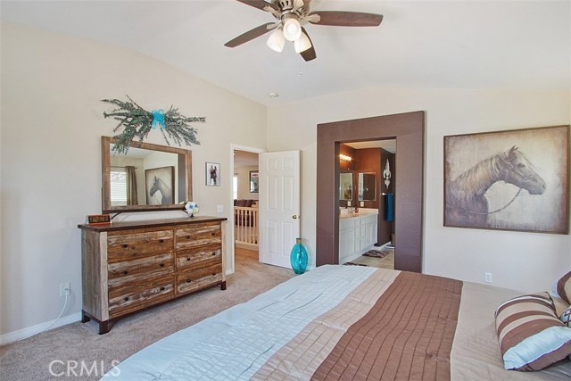 Master bedroom looking towards master bath. Nice ceiling fan,  6 panel doors throughout the house.