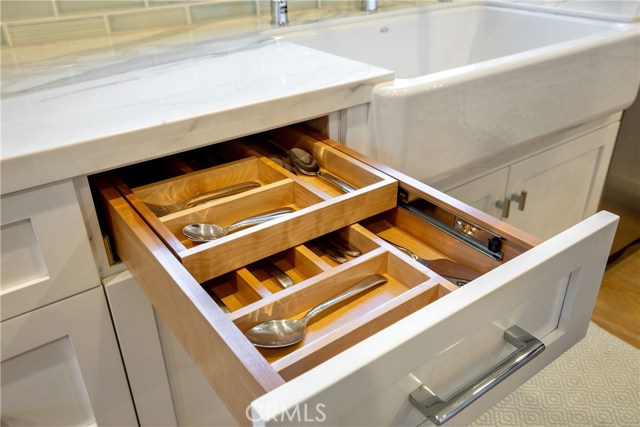 Conveniences to be discovered with the two-level utensil drawer.