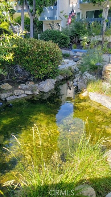 Rest on the bench near the stream.