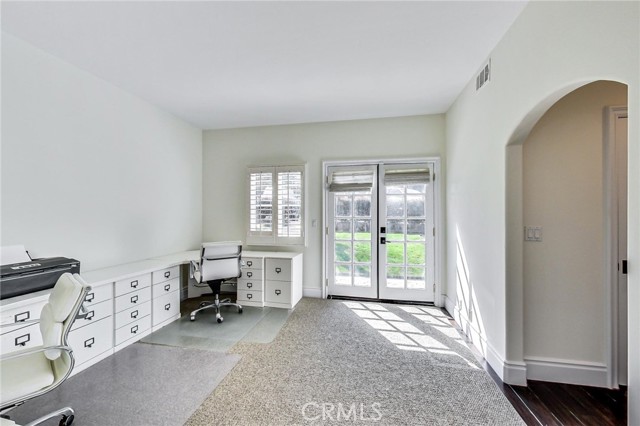 Large front facing (southern exposure) bedroom on entry level. This is bedroom #1 and currently used as an office. French doors lead to front yard.
