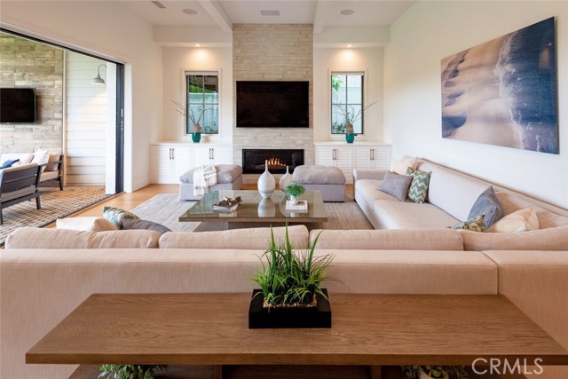 Family room w/ fireplace opens onto the patio