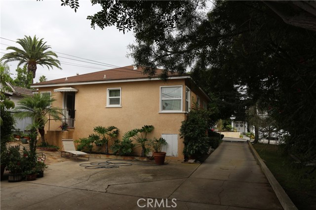 Patio to the left; driveway to the street on right