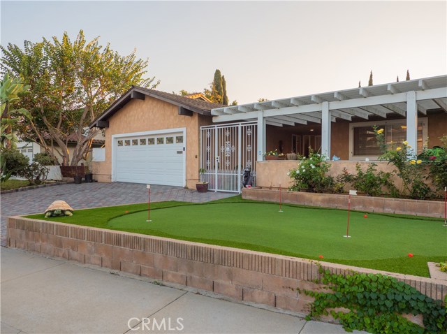 AstroTurf in front and back yard for environmentally friendly low maintenance green grass all year long!!