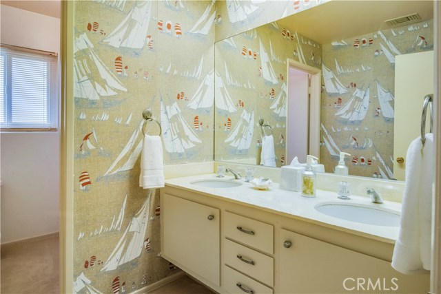Hallway bathroom with double vanity