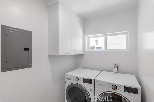 Laundry room next to the garage.