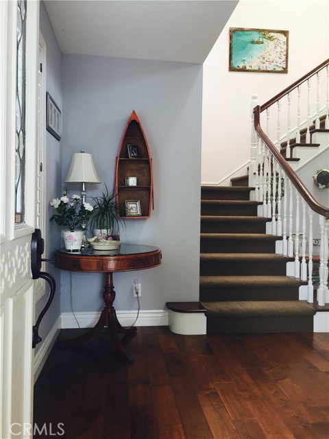 Entry with wood floors and skylights