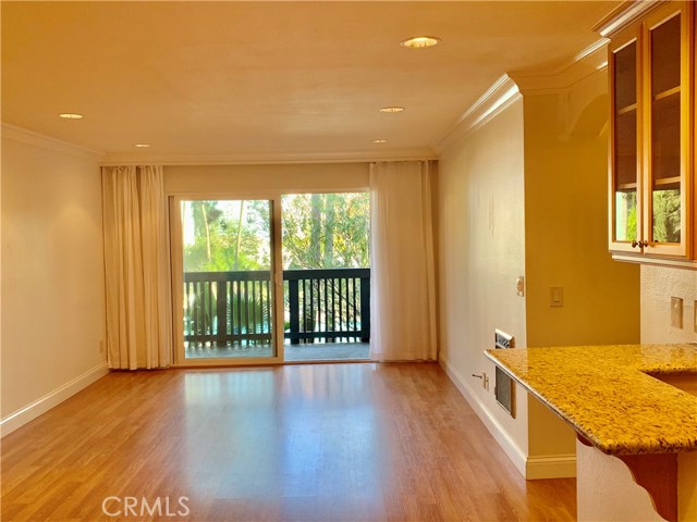 Immaculate Living Room with private balcony and view of pool and gardens