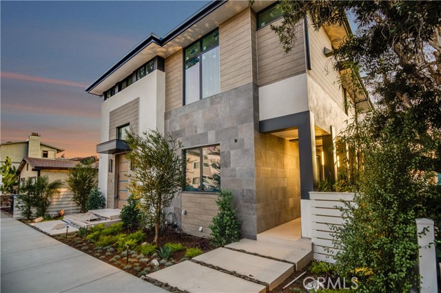 Drought tolerant landscaping and chic architecture come together seamlessly.