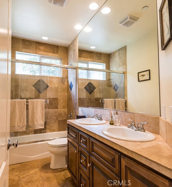 Updated bathroom with dual sinks.