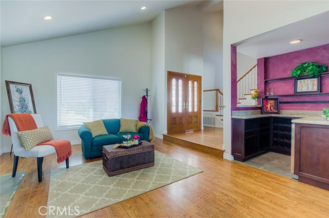 The dramatic entry with vaulted ceilings welcomes you as you walk in the front door.