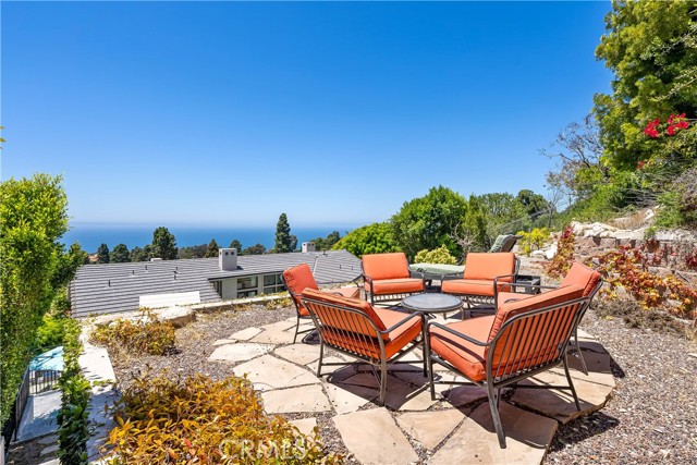 Upper yard sitting area is super inviting!