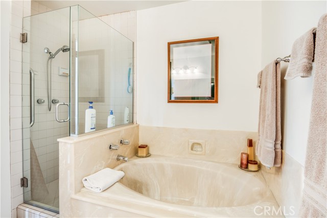 Relaxing soaking tub separate from the shower in master bath.