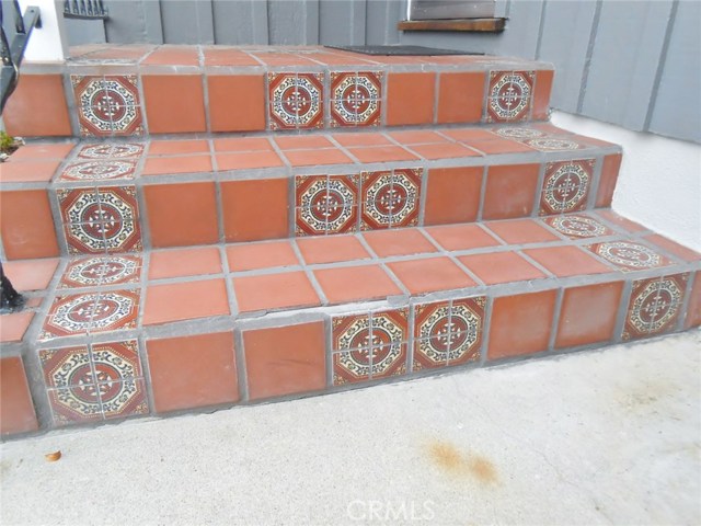 Great Custom Tiling at Front Porch Front Door Entrance.