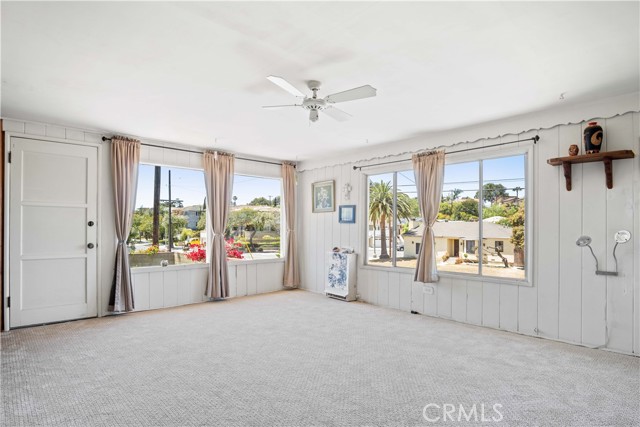 Family room is sunny, bright & has lots of windows and a 