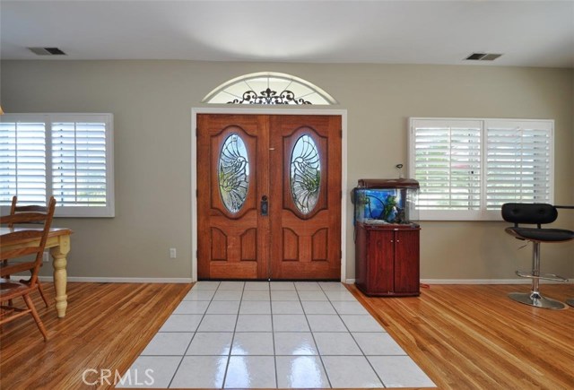 The double doors with stained glass entry